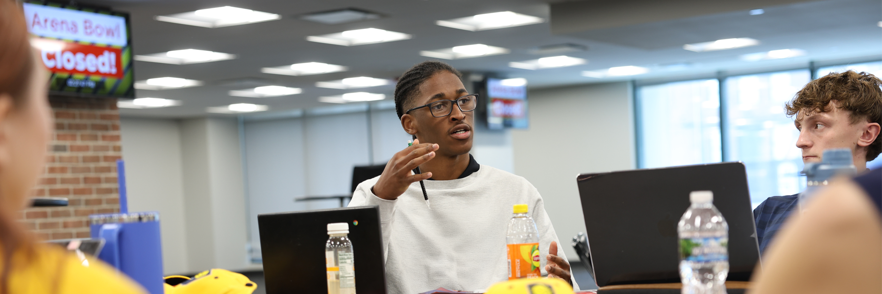 Students sitting at a table having a discussion