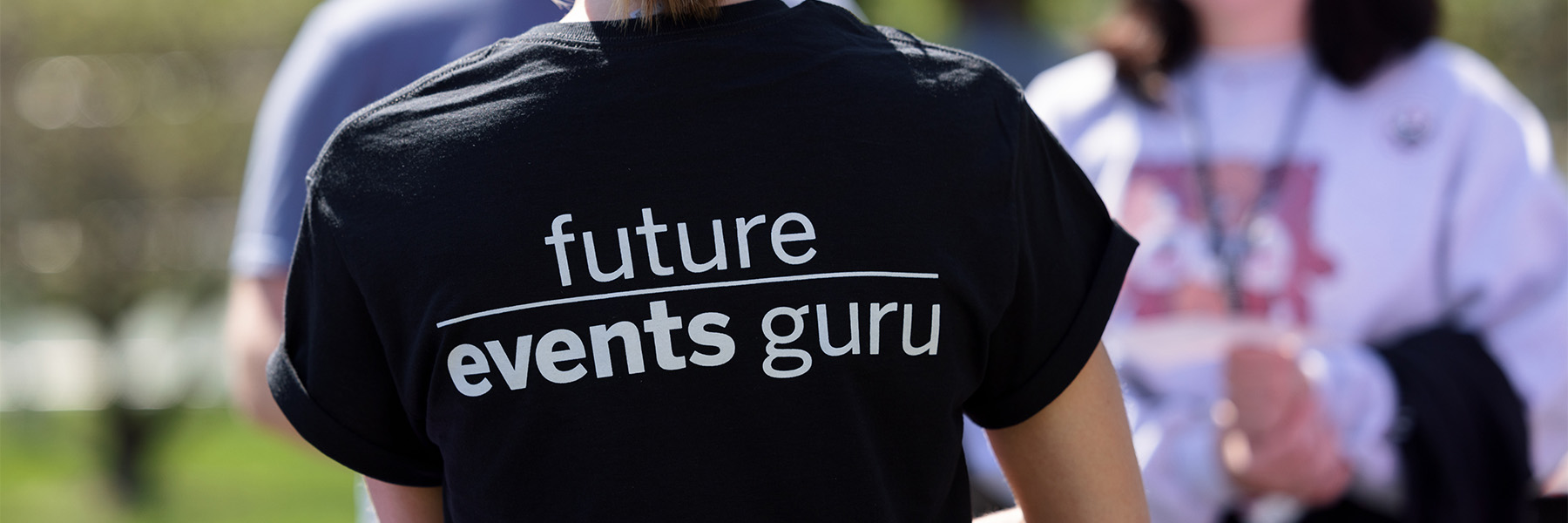 The back of a shirt reading Future Events Guru