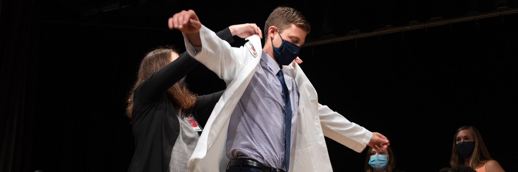 Students get coated during their white coat ceremony