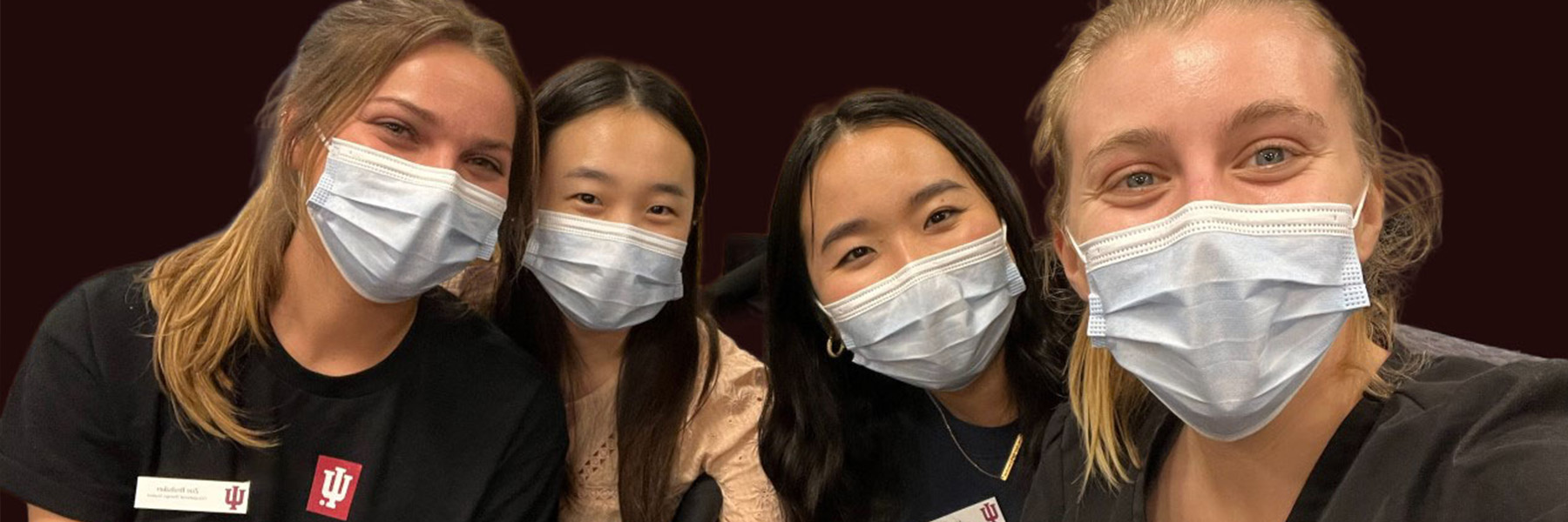 A group of masked students at a medical clinic