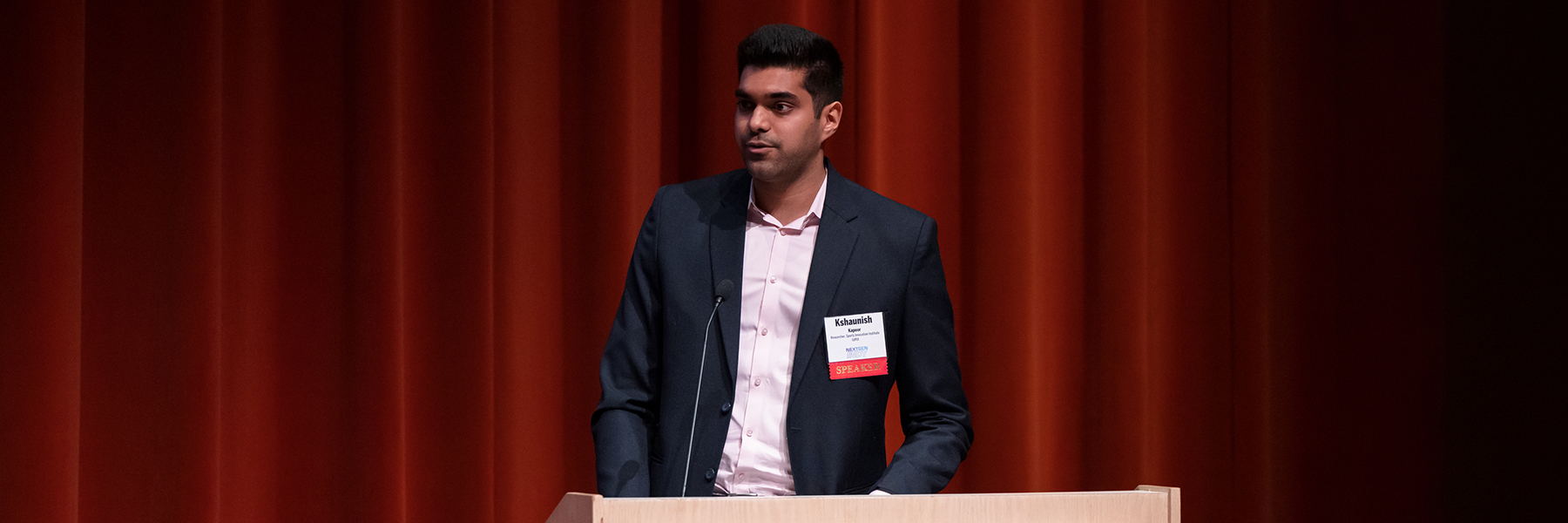Research student Shaun Kapoor presents research project findings to IU Indianapolis audience. 